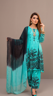Woman wearing a turquoise traditional outfit with black patterns on a beige background